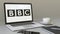 Laptop with British Broadcasting Corporation BBC logo on the screen. Modern workplace conceptual editorial 3D rendering