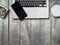 Laptop and cappuccino and cactus on wooden board top angle view