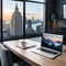 Laptop and a coffee on an office desk with window looking out from city skyscraper