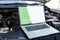 Laptop computer on car hood for engine diagnostic