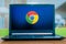 Laptop computer displaying logo of Google Chrome