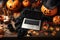 Laptop computer on Happy Halloween decorations table background.