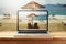 Laptop computer with sunny beach image on wooden table. Summer vacation photo