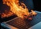 Laptop on Fire with Intense Flames