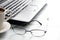 Laptop and glasses blurred abstract business background