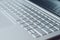 Laptop keyboard closeup. Silver netbook