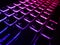 Laptop keyboard is glowing in the dark. Colse up for RGB Keyboard. Bright multicolor macro background flickering video button