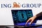 Laptop with lock symbol on screen on background of  ING Group logo