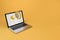 Laptop and megaphone on screen, yellow background, marketing. Mockup