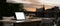 Laptop mockup on an outdoor dining table in a beautiful restaurant with beautiful city view