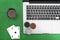 Laptop, poker cards and poker chips