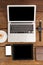 Laptop, smartwatch, smartphone and digital tablet with cup of coffee