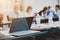 A laptop stands on a table in a room for business meetings and negotiations