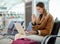 Laptop, travel and woman on video call in airport lobby, online conference or meeting. Immigration, freelancer wave and