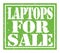LAPTOPS FOR SALE, text written on green stamp sign