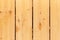 Larch boards, wall panels of the ecological house. Structure of larch wood. Place for text.