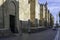 Lareral of the Mosque of Cordoba with the statue of San Rafael at the end of the street