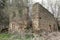 Large abandoned building of water mill with bricked windows