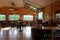 Large airy tasting room with tables and windows for company, Critz Farms & Brewing Company, Cazenovia, New York, 2018