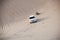 Large all wheel drive white SUW 4x4 drifts on desert safari on dunes exreme racing in arabia travel rally on sand in