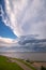 Large anvil of a thunderstorm over a lake