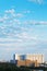 Large apartment building under blue summer sky