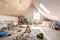 large attic room decked out as playroom with colorful toys, games, and books