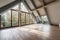 large attic room with glass windows and view of the garden or park