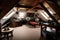 large attic room with telescope and star charts, ready for stargazing