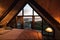 a large attic room with a view of the sea and sunsets