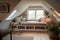 large attic room with window seat, reading nook and cozy throw pillows