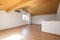 Large attic with wooden floors and exposed beams