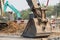 Large backhoe heavy dig soil stone