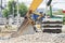 Large backhoe heavy dig soil stone