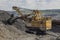 Large backhoe loader in the quarry in Ukraine