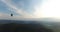 Large balloon flies over a beautiful forest scenery. Aerial view