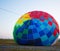 A large balloon lies on the ground