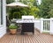 Large barbecue cooker on cedar deck