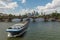 Large barge moving upstream in front of the skyline, Frankfurt, Germany