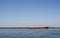 Large barge on the Volga river in clear summer day.