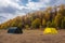Large basecamp tents on colorful mountains background
