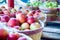 Large basket full of fresh locally grown red apples at lo