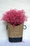 Large baskets woven from hemp rope with full pink flowers