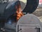 Large BBQ smoker with flames