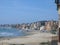Large beach with buildings in winter in Nettuno, Italy.