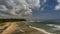 Large Beach with solitary man walking