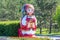 A large beautiful folk doll stands on the Volga River Embankment.