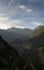 large and beautiful mountains with green forests in the sunlight under a blue sky