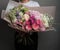 A large beautiful spreading bouquet of flowers in the hands of a girl, the work of a florist