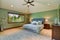 Large bedroom with green interior.